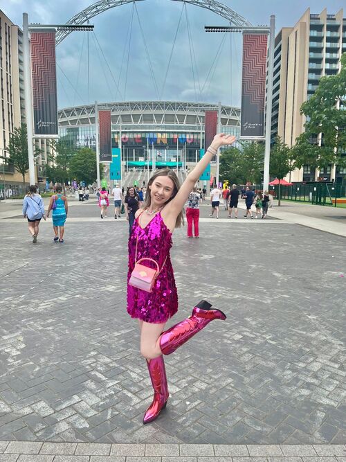 A pastel-colored bodysuit with sparkly boots